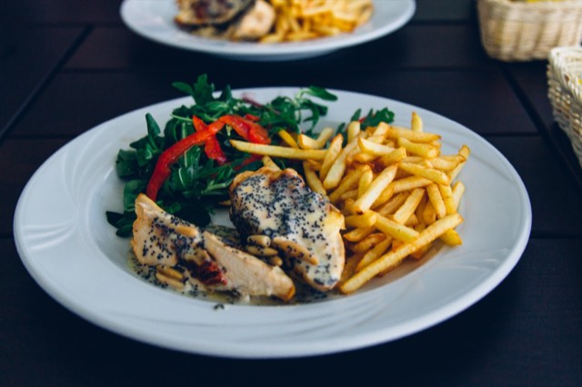 Poppy-seed chicken with golden fries on a share card